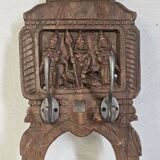 Coat rack with 2 hooks on a frieze of divinities in teak