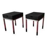 A pair of minimalist bedside tables