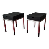 A pair of minimalist bedside tables
