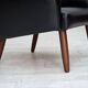 1970s, Danish highback armchair, black artificial leather, teak wood legs.