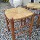 Suite de quatre tabourets - chêne et paille - v . 1950.