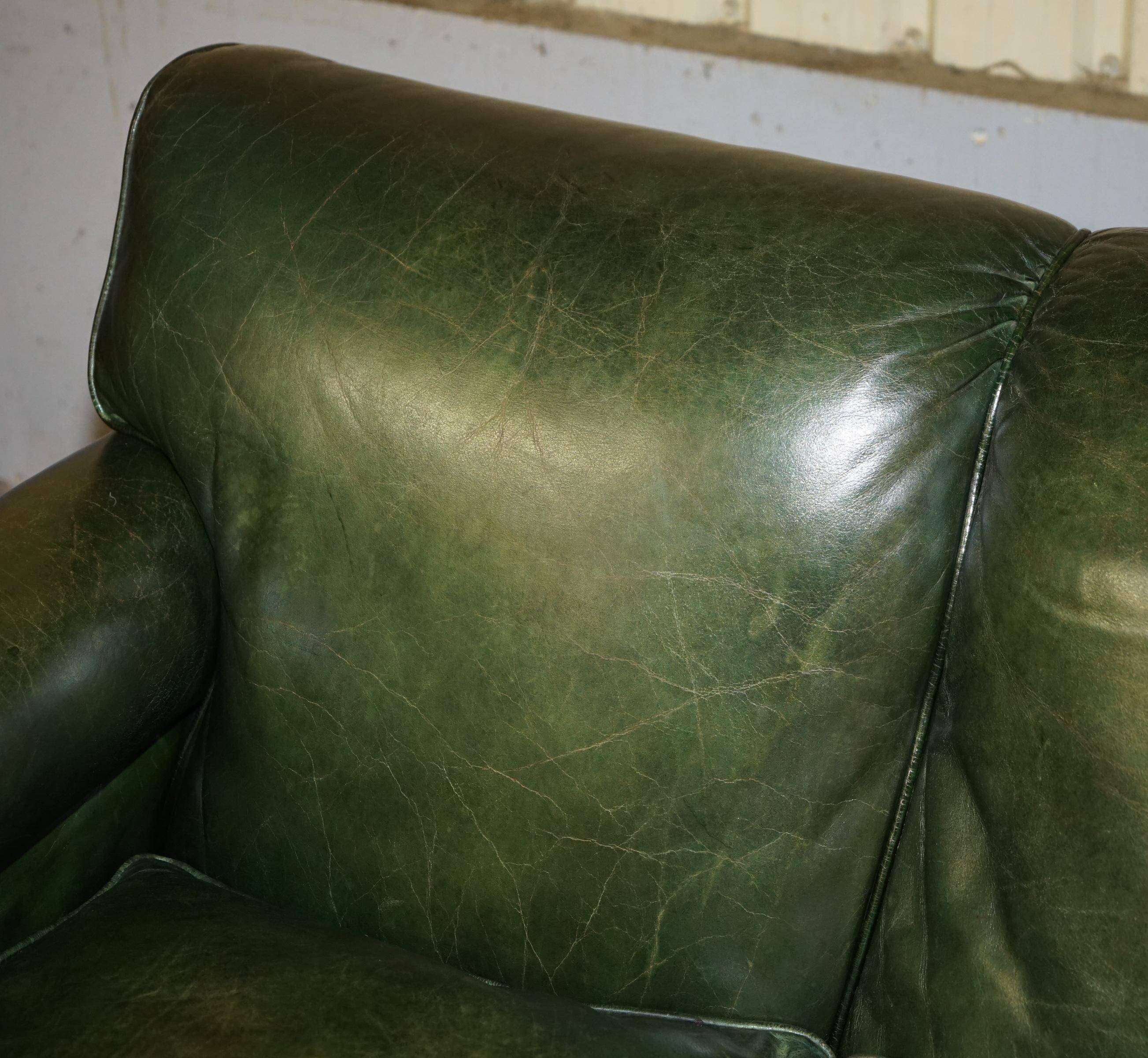 Victorian leather canapé, shield armrests, stamped Maple & Co.