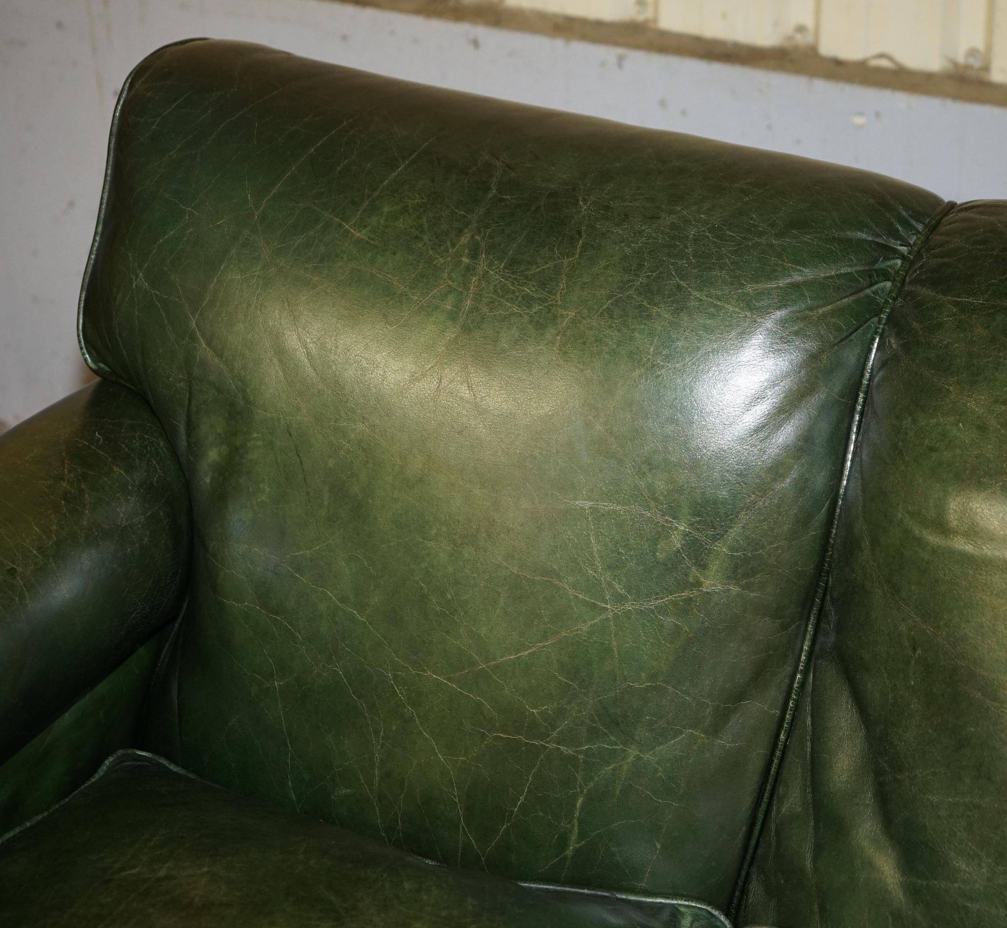 Victorian leather canapé, shield armrests, stamped Maple & Co.