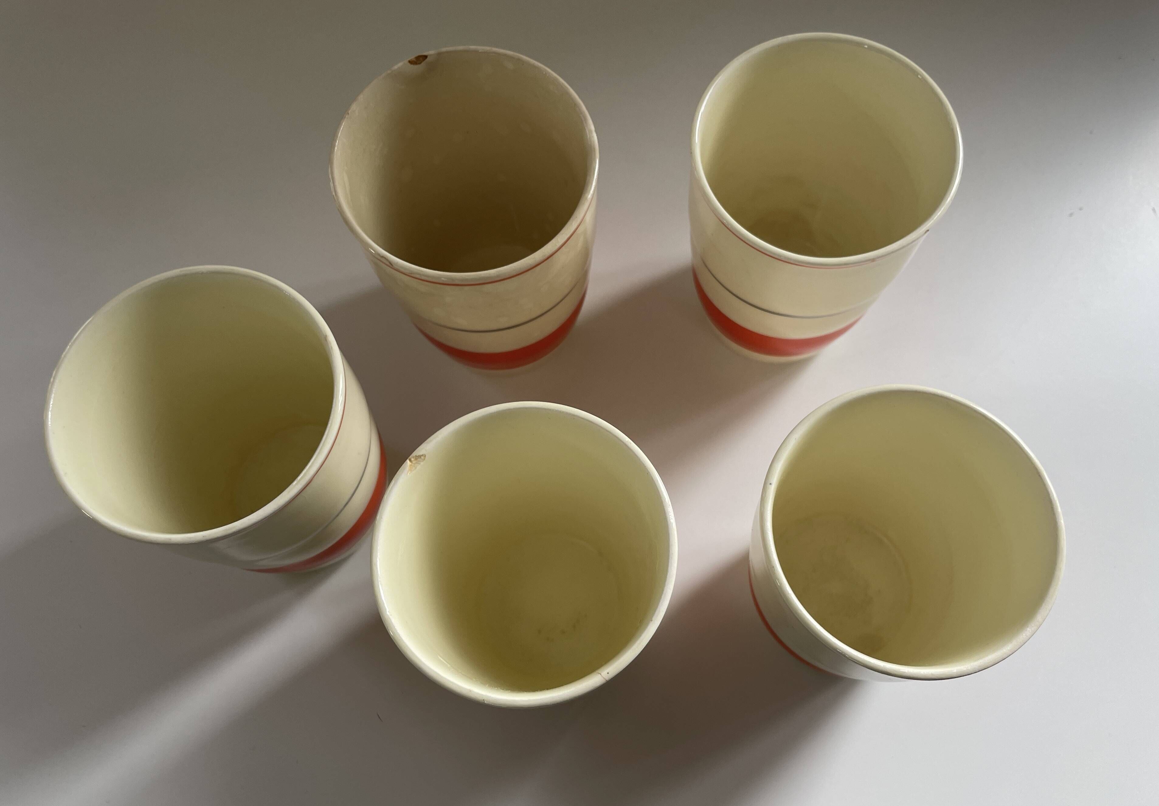 Red, white and silver porcelain jug set by Edmond Bellefroid for Robo.