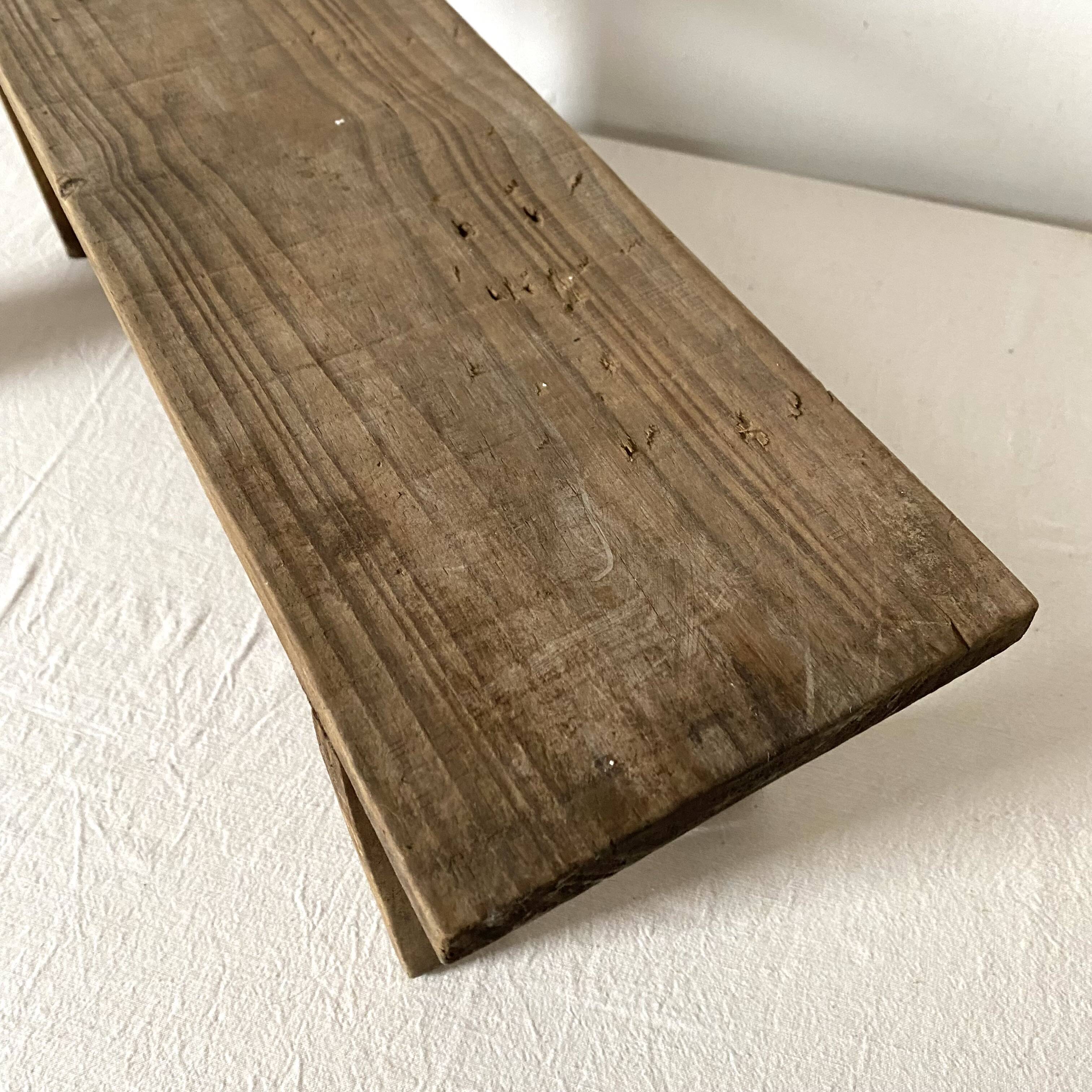 Low stool in raw wood