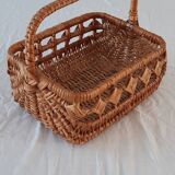 Old wicker basket with diamond-shaped decorations
