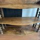 Antique wall shelf made of turned wood and spools of thread, late 19th century.