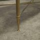 Marble coffee table with brass legs, height 46 cm.