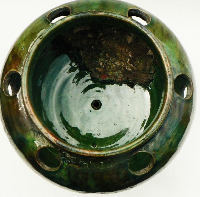 details on old bulb pot in glazed earthenware