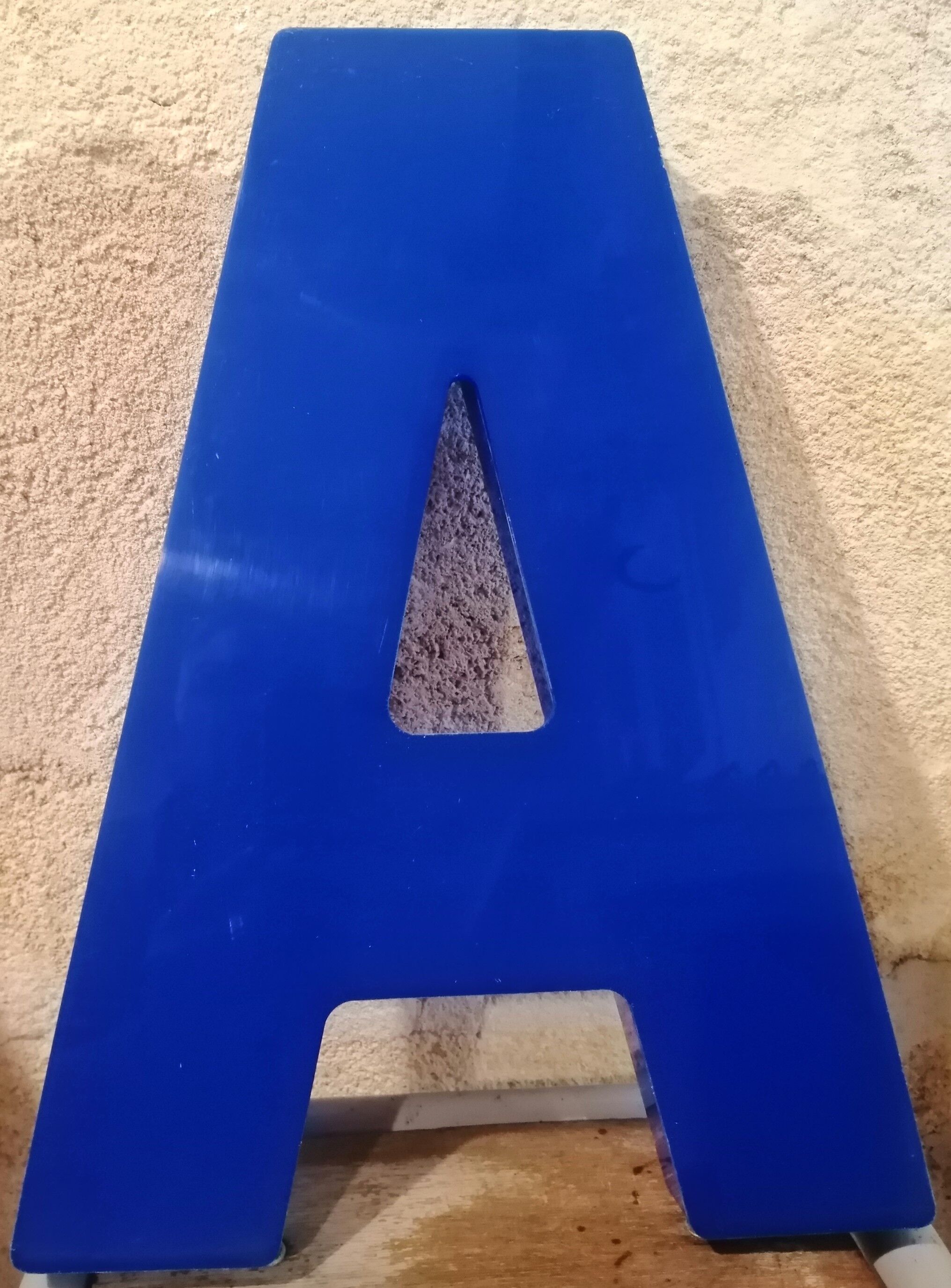 Letter A sign in vintage blue plexiglass