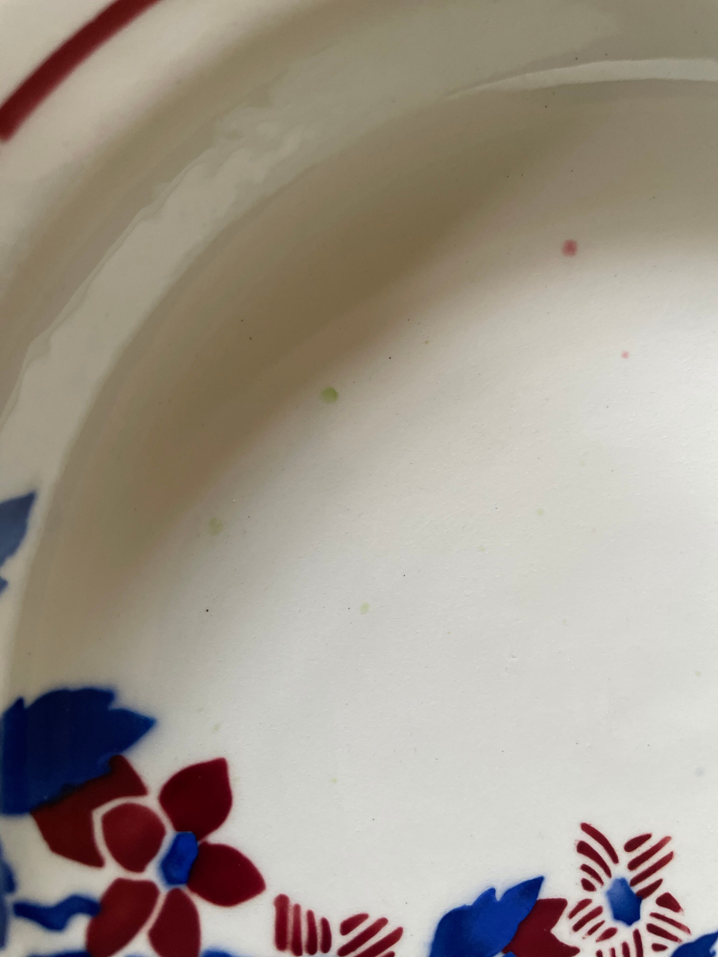 Saint Amand hollow plates decorated with red and blue flowers