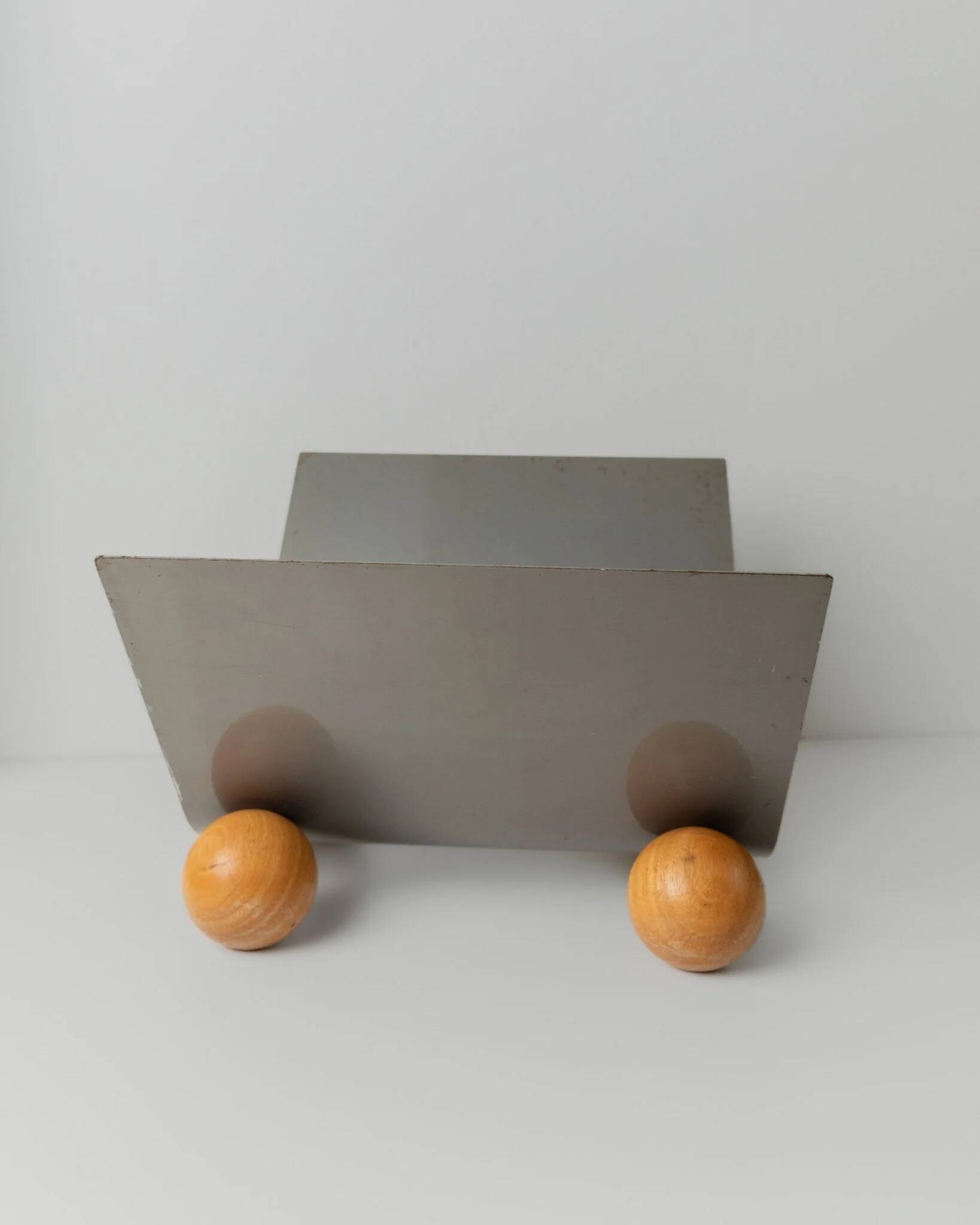 Silver metal magazine rack with wooden ball feet - Space Age 1980s retro storage