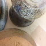 Three stoneware empty pockets with blue drips
