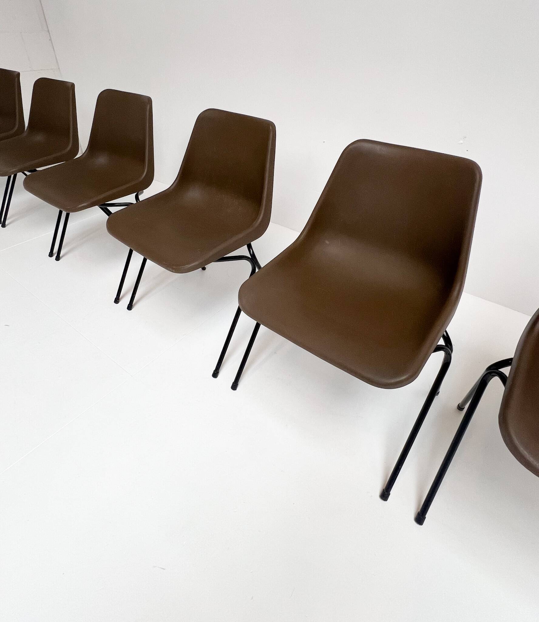 Brown and black set of 6 Polyprop chairs on a metal frame. The Polyprop cha