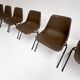 Brown and black set of 6 Polyprop chairs on a metal frame. The Polyprop cha