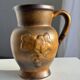 Speckled stoneware jug with grape pattern H17