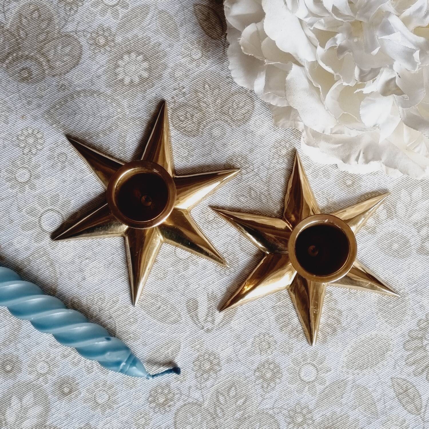 Duo of brass star candlesticks