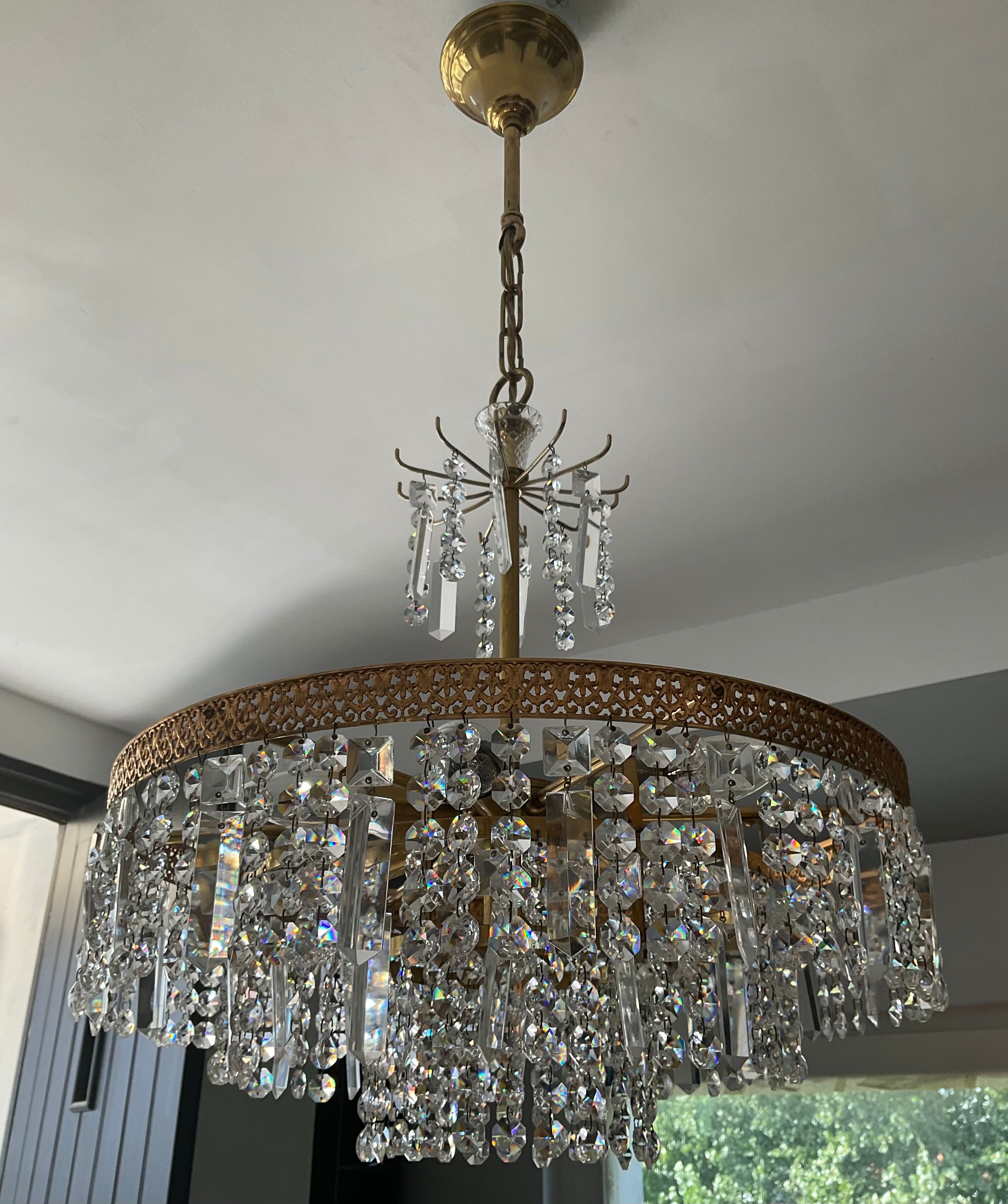 Old brass chandelier and crystal grapevines