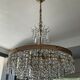 Old brass chandelier and crystal grapevines