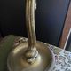 Table lamp with brass fish and draped glass tulip.