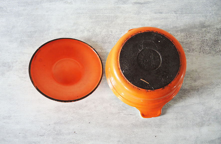 Old cast iron pot enamelled orange Le Creuset