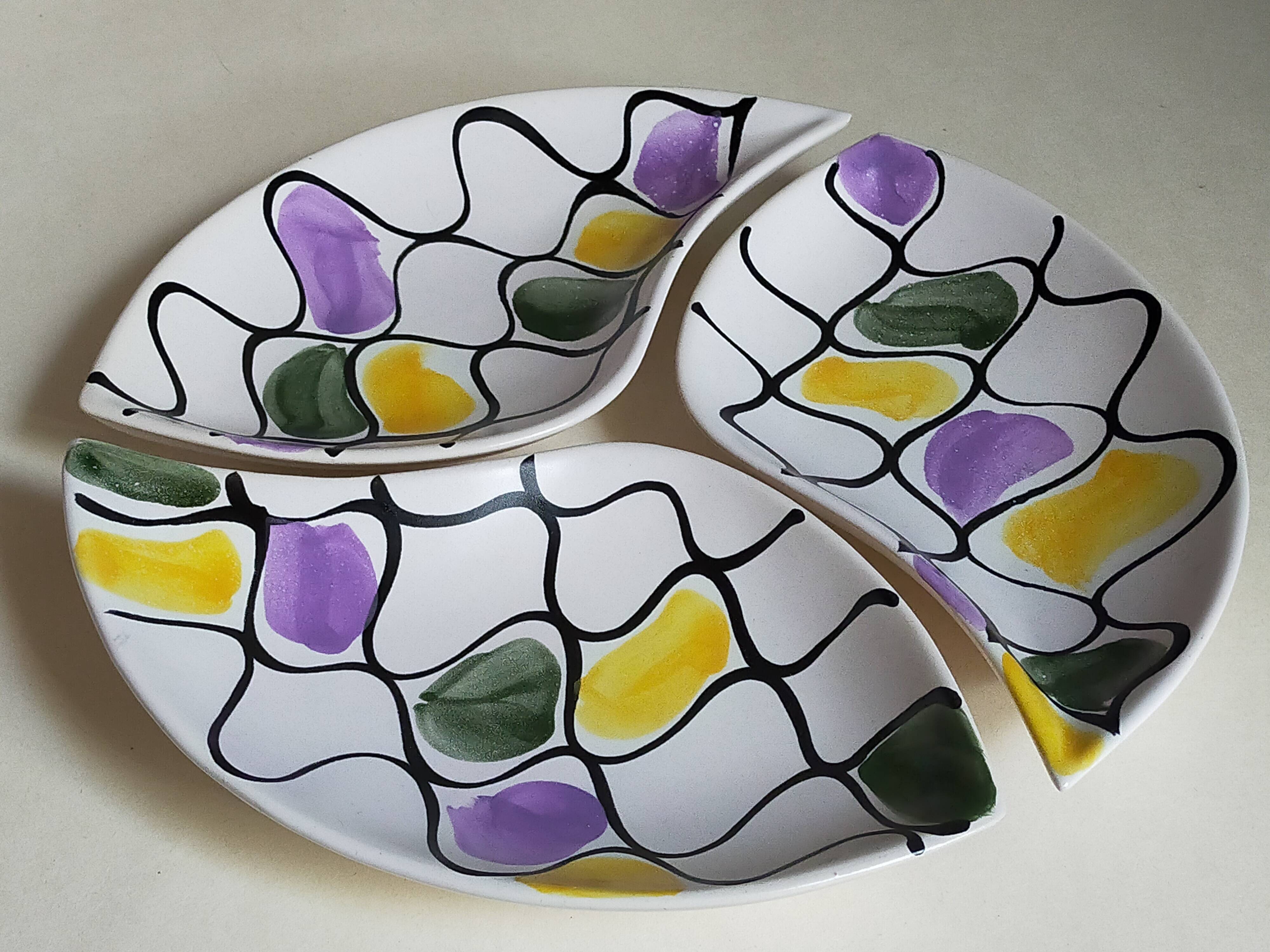Three vintage free-form ceramic ravine dishes from the 1950s