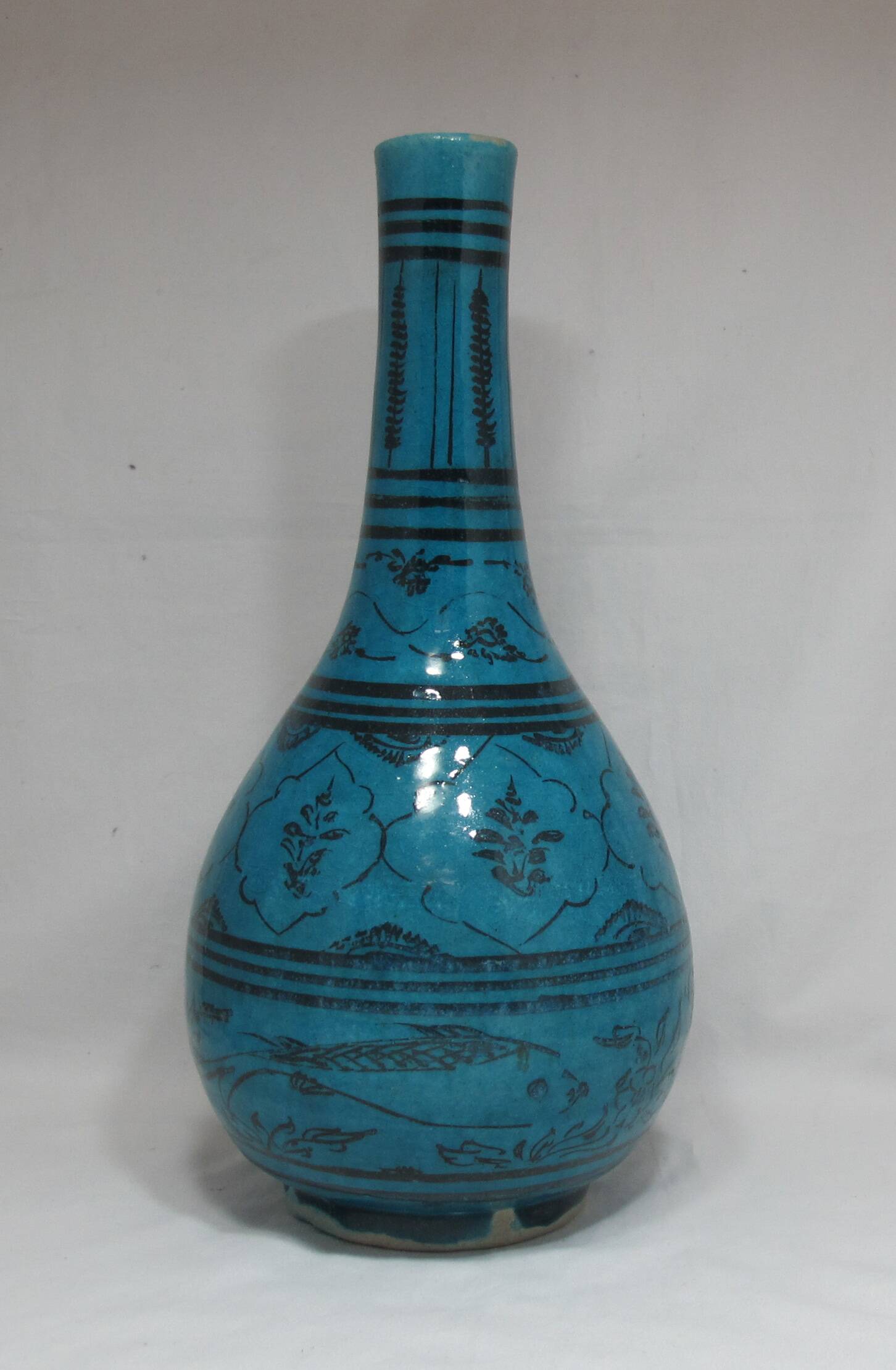 Islamic ceramic vase with turquoise background
