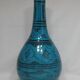 Islamic ceramic vase with turquoise background