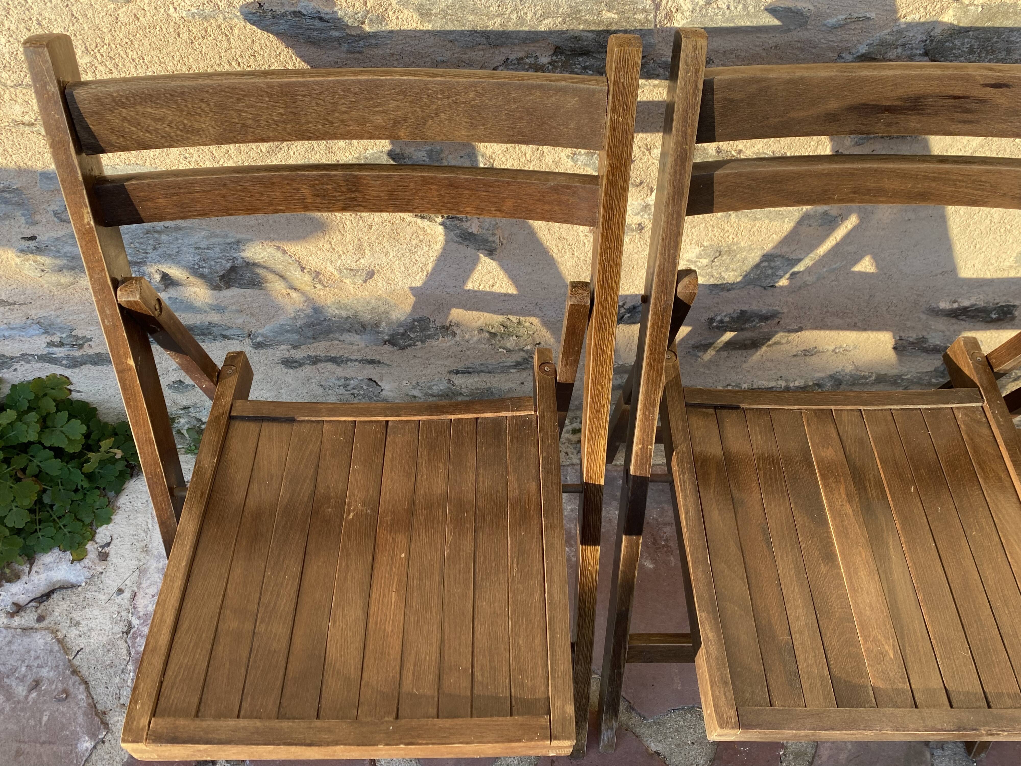 Three wooden folding chairs