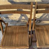 Three wooden folding chairs