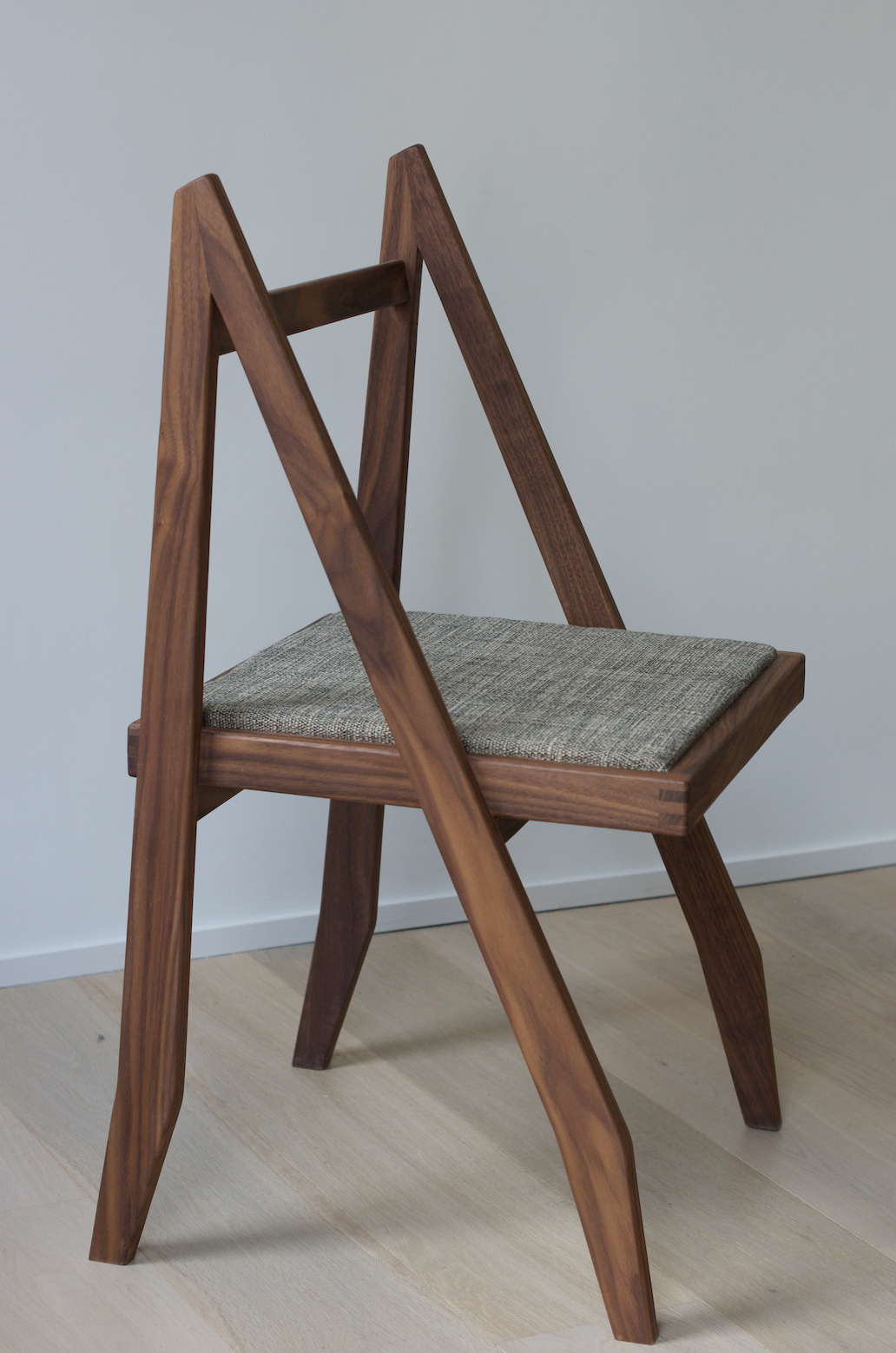 Walnut chair designed by Martin Gillis Studio