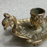 Bronze hand candlestick in the shape of a peacock