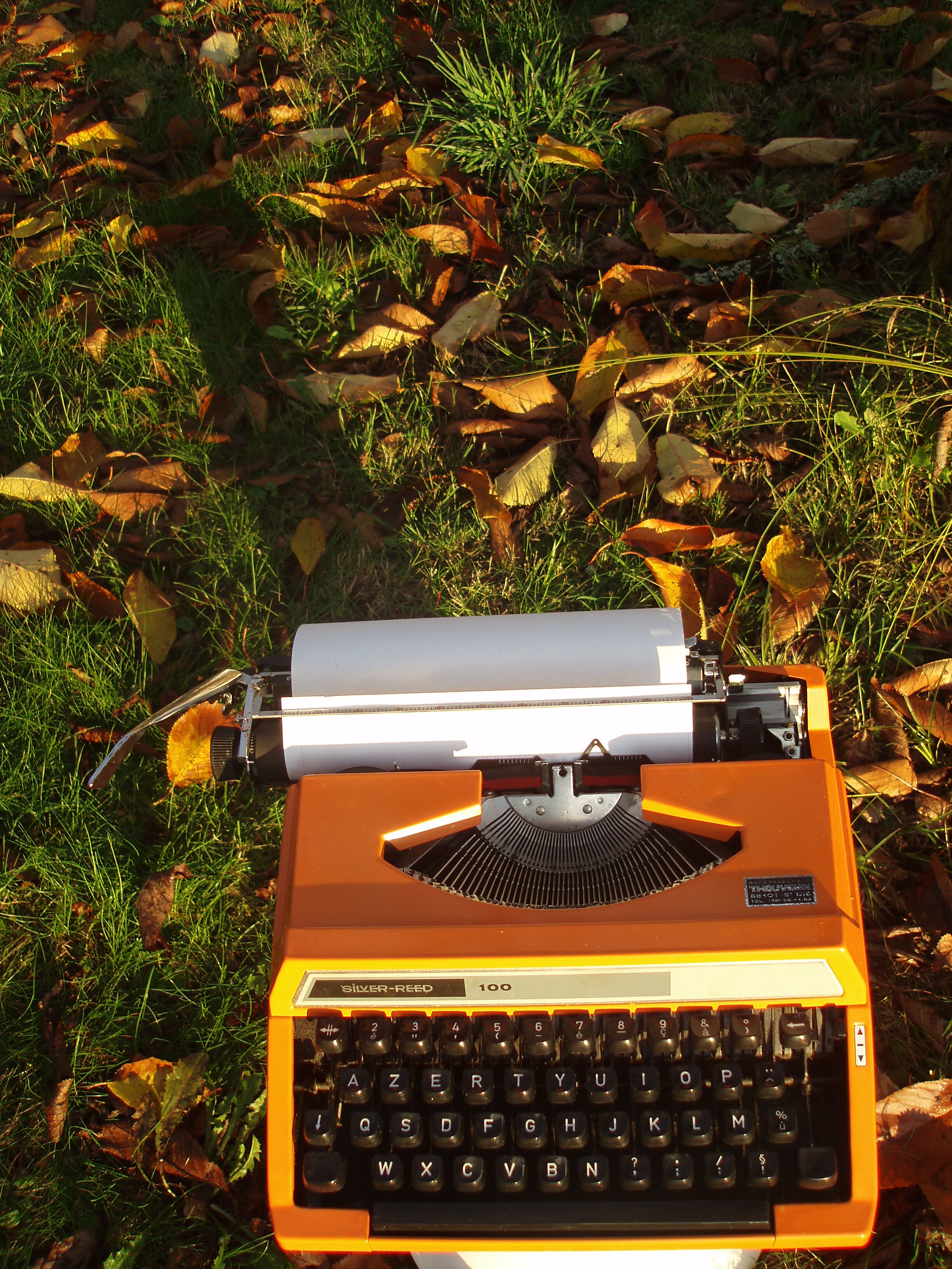 Silver reed orange and black typewriter with bag
