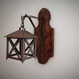 Wall lamp in wrought iron and old wood