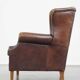 Wing chair made of sheepskin and neatly finished with black piping