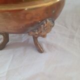 Hammered copper planter cover, lion's head handles and feet