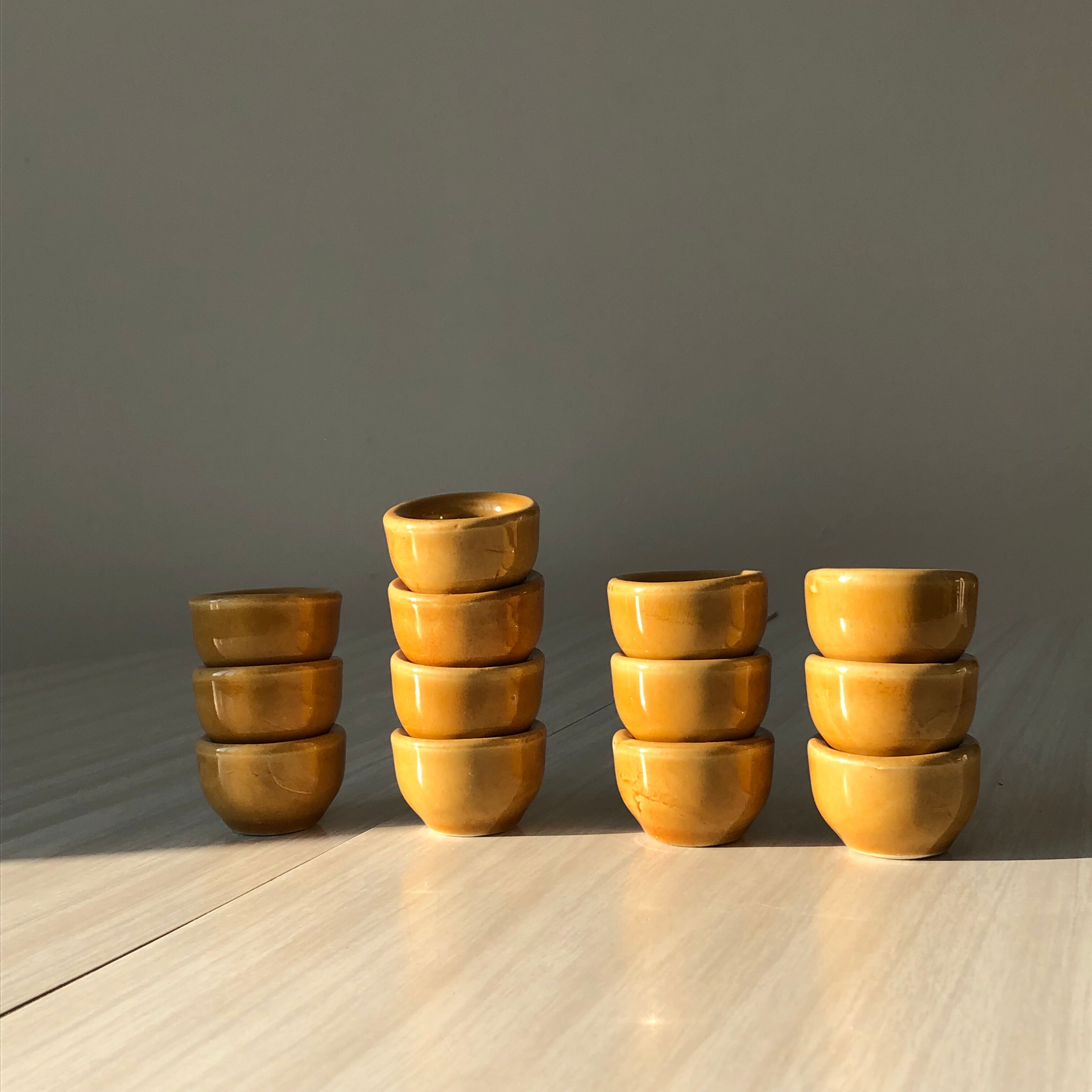 13 snail buckets or eggcups in fire porcelain glazed yellow-brown color