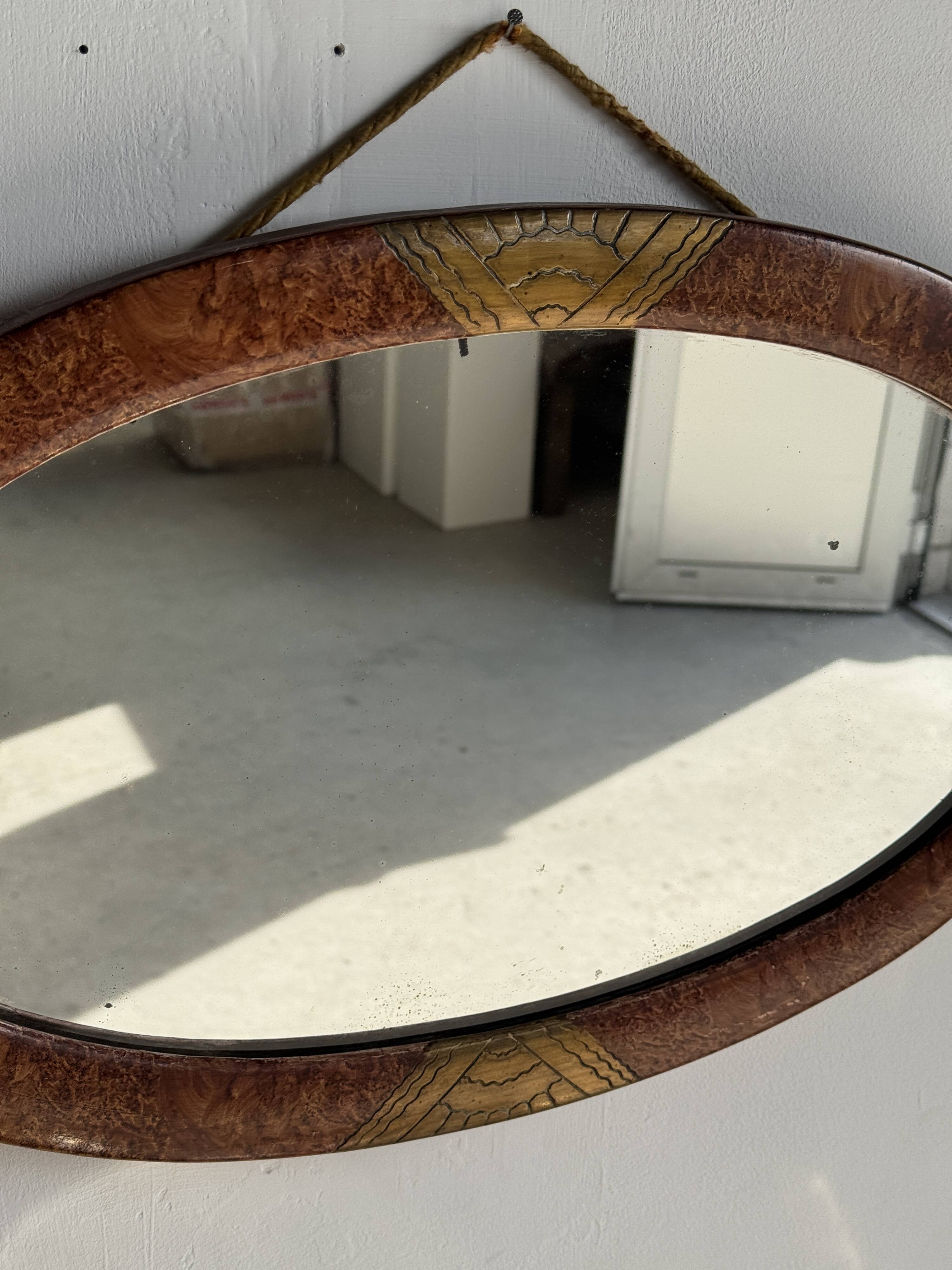 Small oval Art Deco mirror in brown and gold 33x54.
