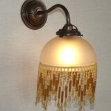 French vintage bronze effect single wall light with opaque beaded glass shade.