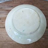 Old barbotine plate with vine motif