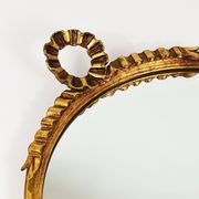 Round wall mirror in gilded wood, mid-century, C. Allodi & G. Subelli, Italy, 1950s.