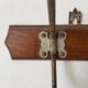 Old wooden and metal wall-mounted coat rack.