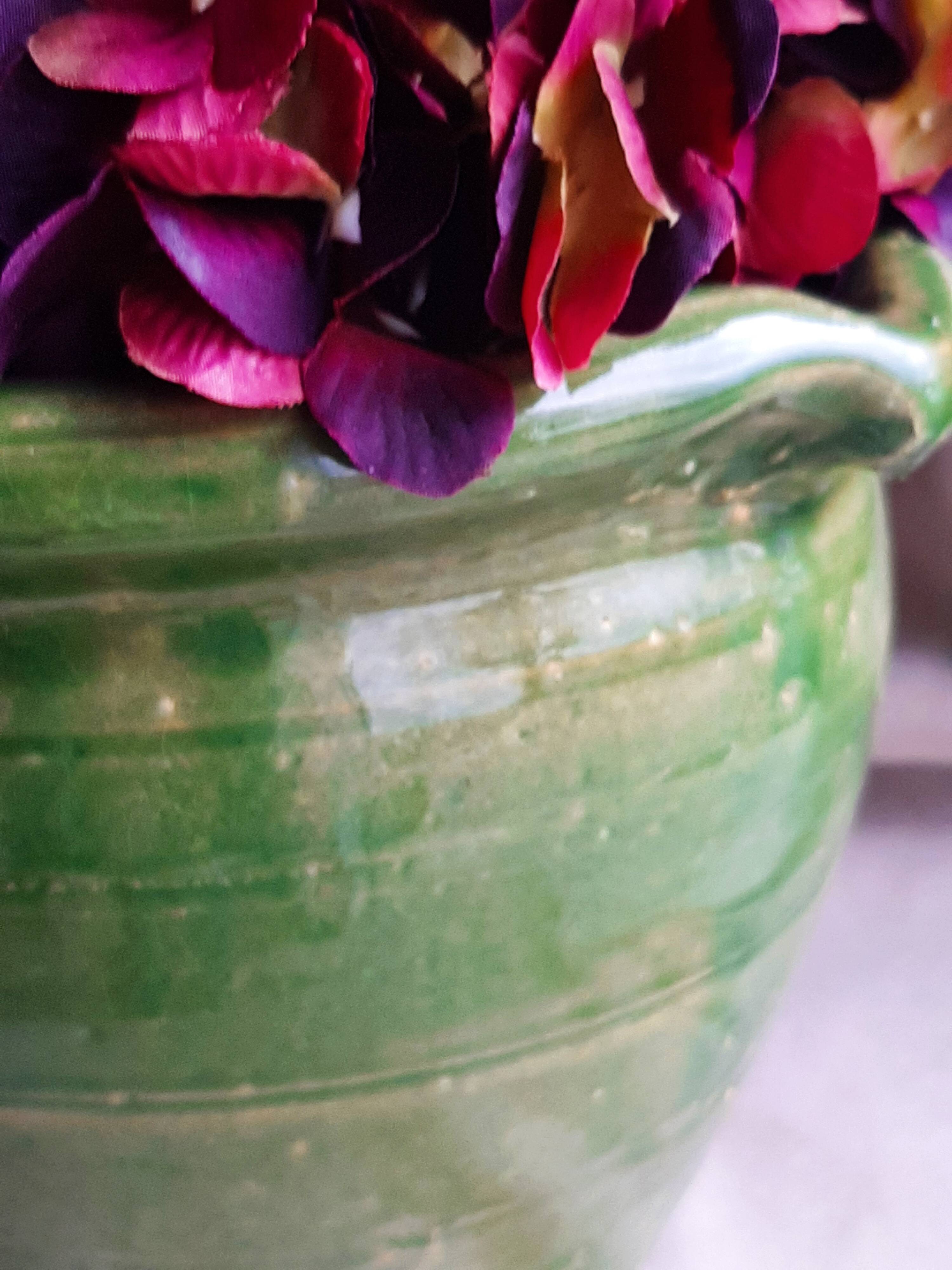Glazed green terracotta pot.