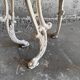 Pair of cream-white cast iron side tables with wooden tops — neoclassical shabby-chic
