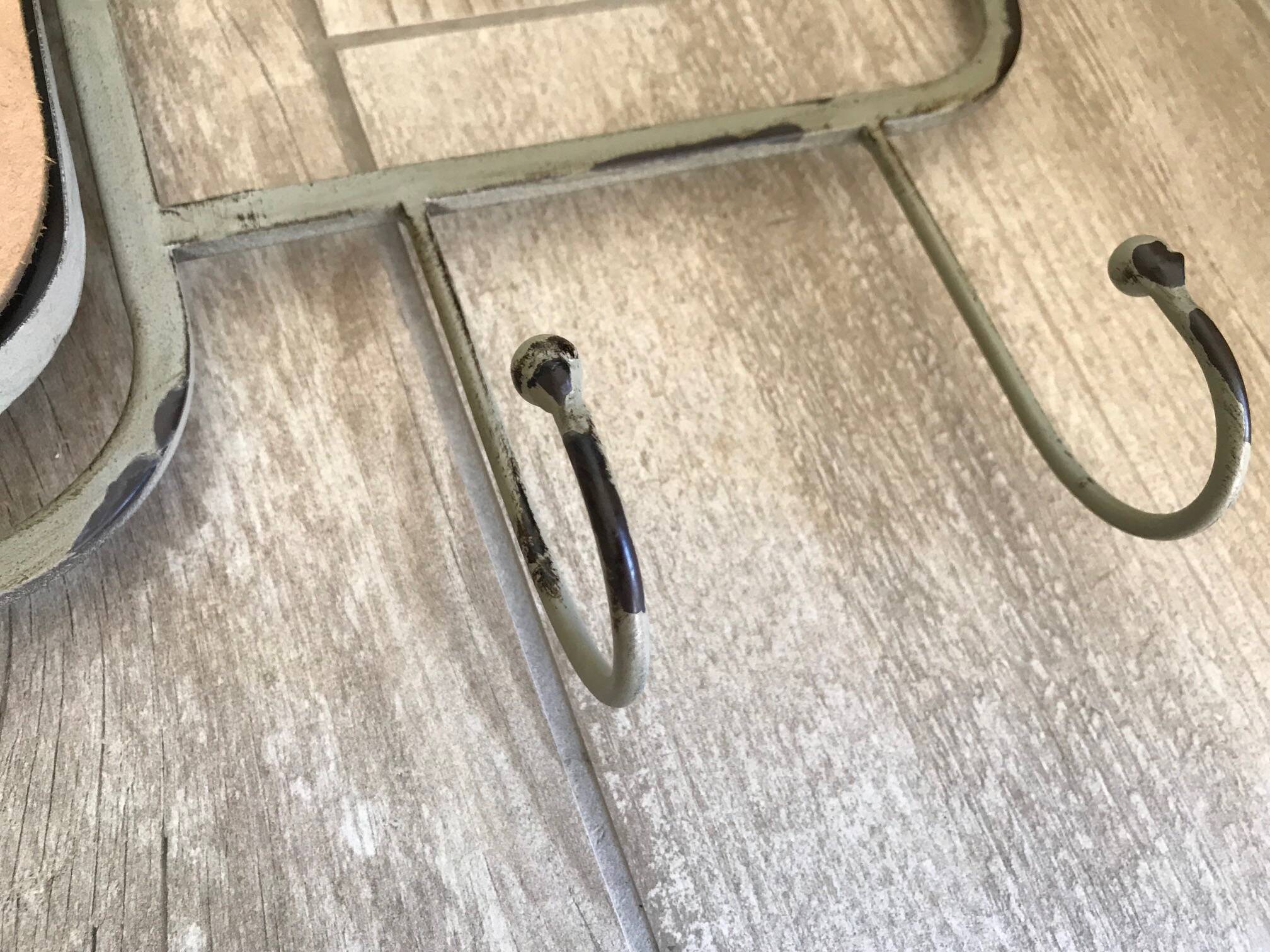 Gray-green patinated metal hat rack