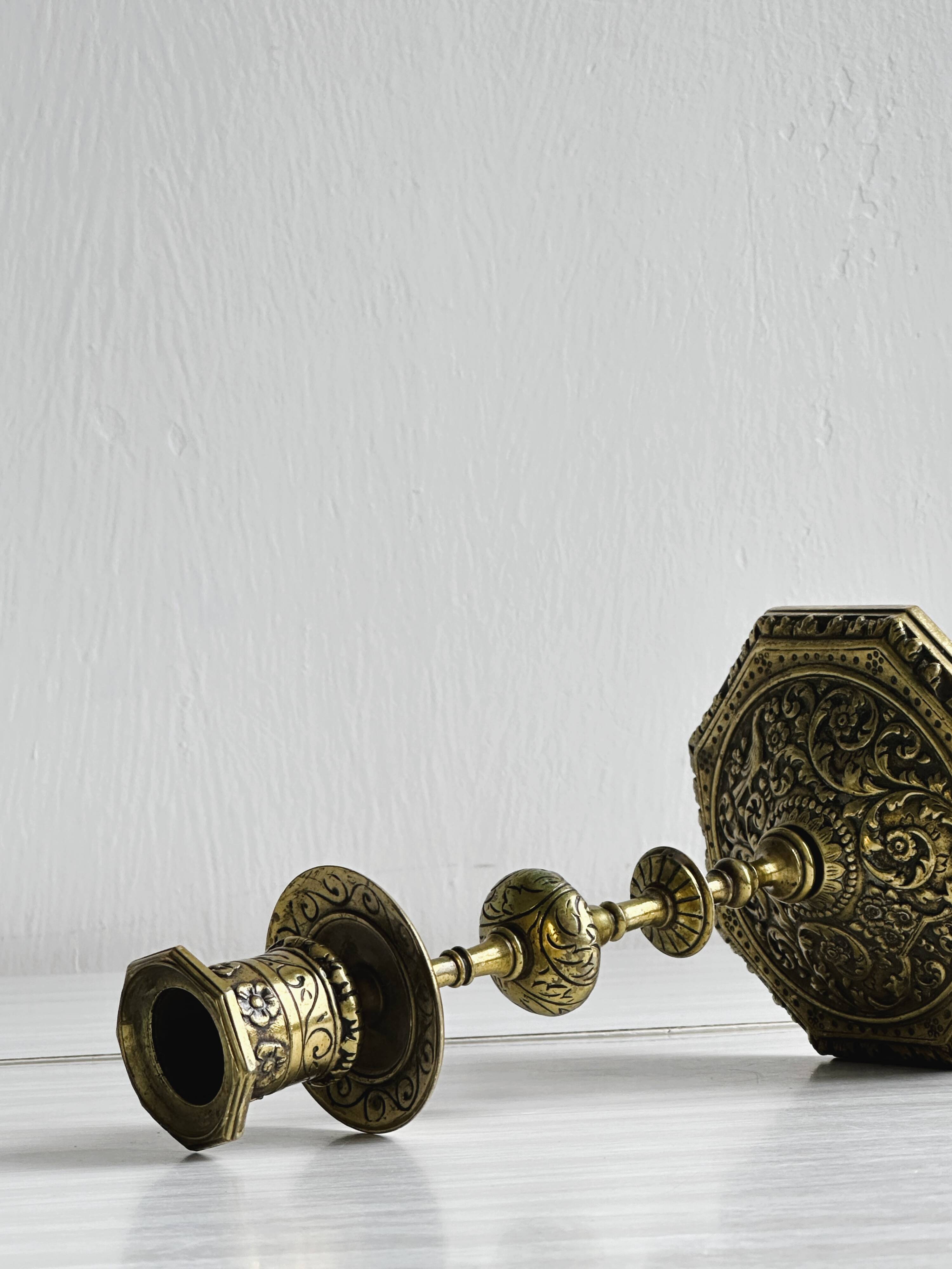 Carved brass candlestick holder
