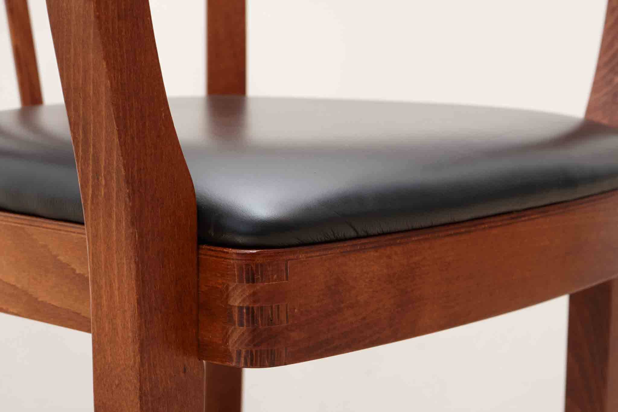 Stoelcker chair in black faux leather and oak