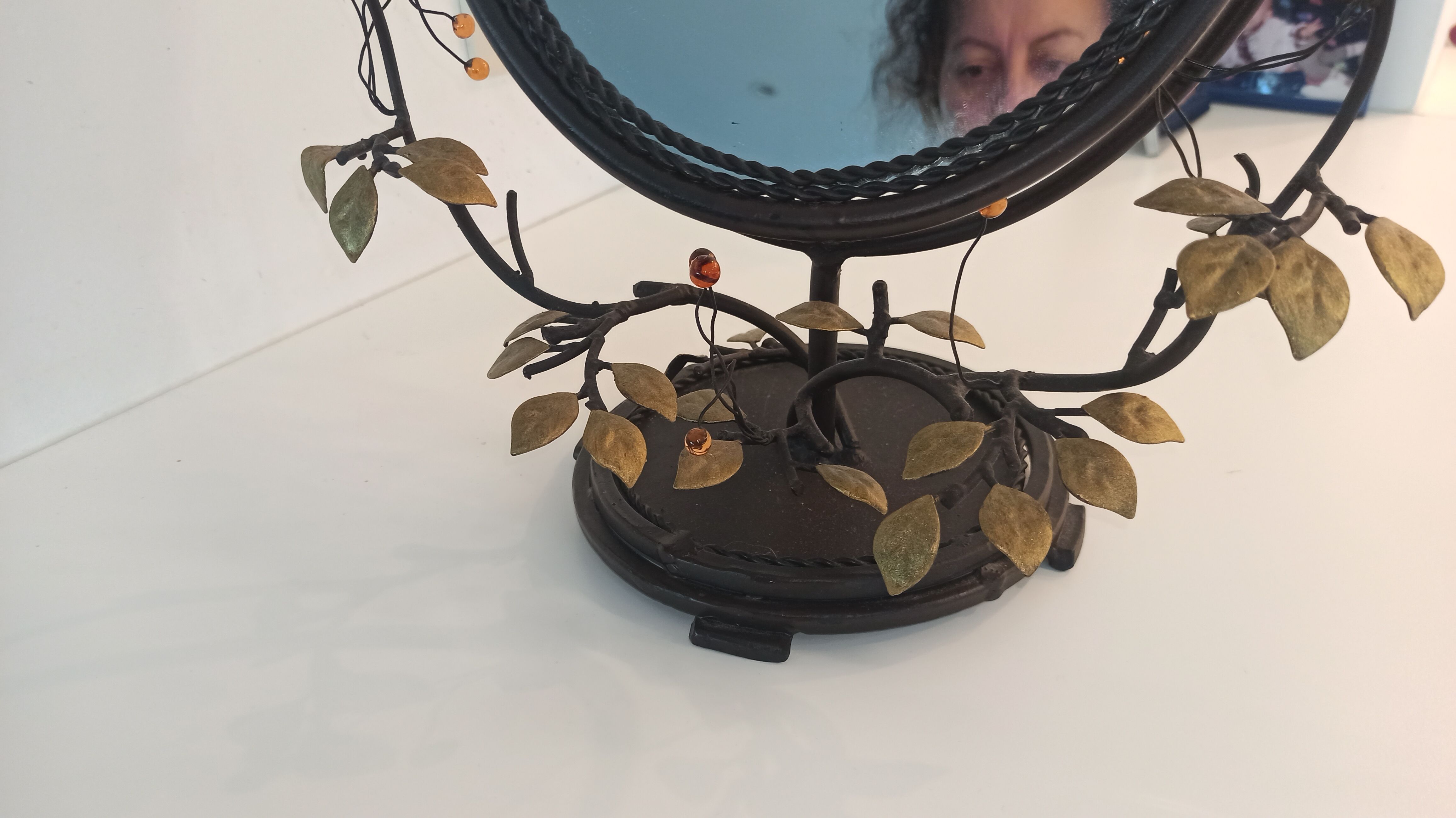 Table mirror, tilting psyche in patinated bronze decorated with leaves and fruits