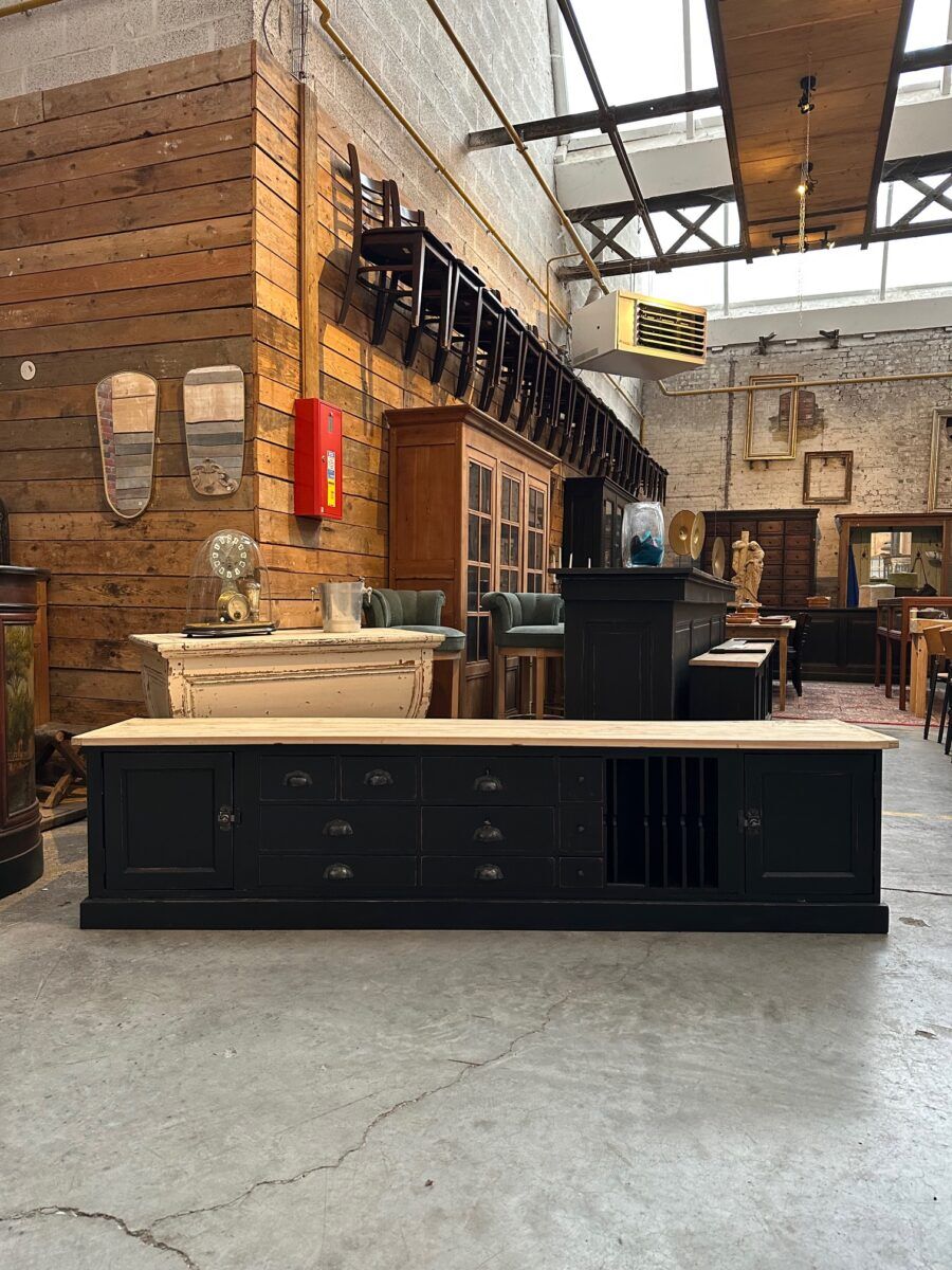 Old workshop furniture transformed into a TV unit.
