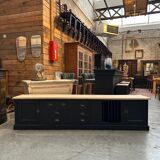 Old workshop furniture transformed into a TV unit.